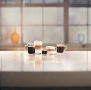 5 different types of coffee in different cups on a bench