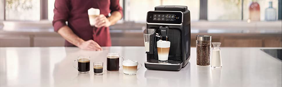 black coffee machine with 5 different coffee types and a man in the background holding a cup of coffee
