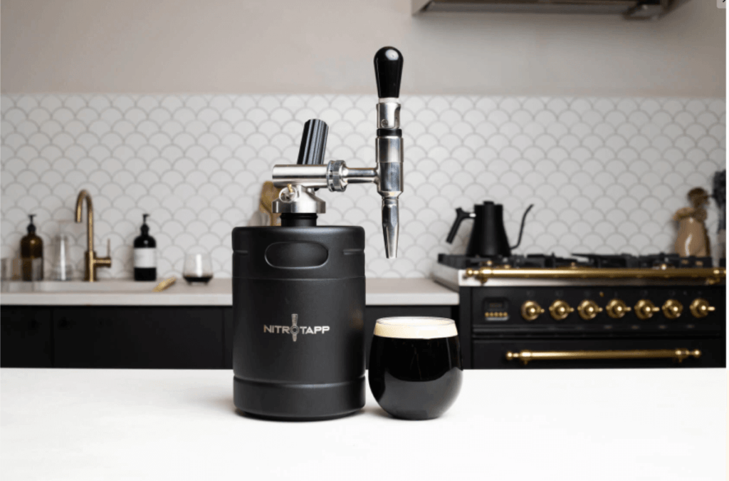 Nitro Tapp Keg with a glass of black coffee in a modern kitchen