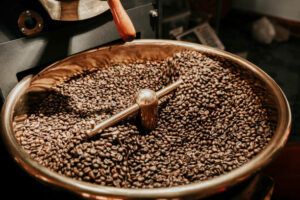 Coffee beans being cooled after being roasted from a coffee roaster machine 
