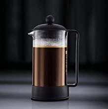 A french coffee press filled with coffee