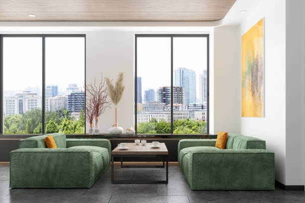 Waiting Room With Green Velvet Sofas, Coffee Table And Cityscape From The Window