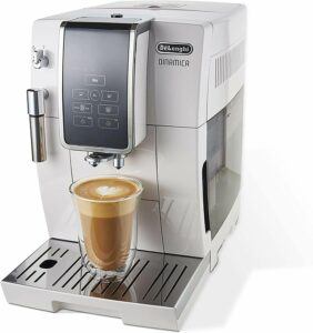 Delonghi Dinamica Coffee Machine with a glass of coffee freshly poured