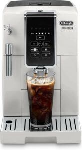 Delonghi Dinamica silver coffee maker with a glass of iced coffee 