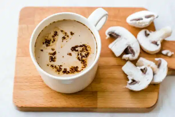 Mushroom Latte Coffee with Milk and Espresso on Wooden Board Ready to Drink. Hot Beverage