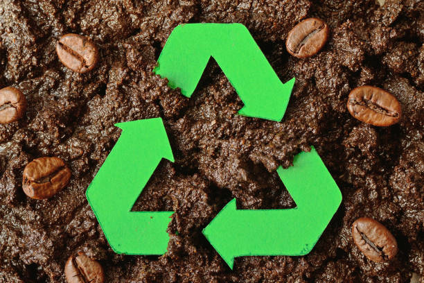 Recycling symbol on coffee grounds - Concept of ecology and recycling