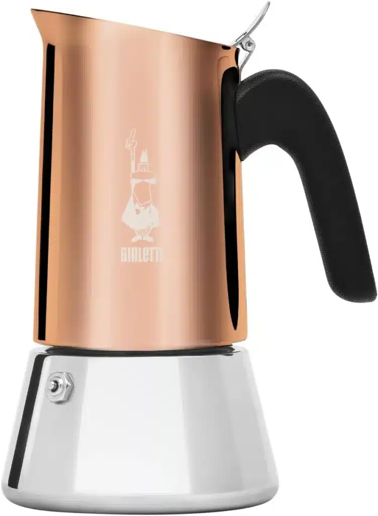 A stainless steel and copper coffee pot with a black handle on a white background.