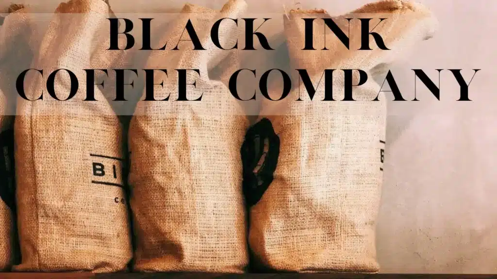 Black Ink Coffee Company written across a stack of coffee hessian bags.