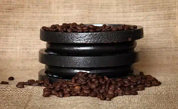 Coffee beans around gym weights