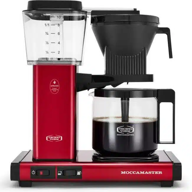 A red technivorm moccamaster coffee machine against a white background.