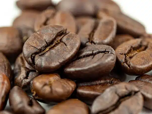 Abstract background of coffee beans.Coffee beans are Robusta. Robusta is praised for its high caffeine content, low sugar content and low acidity. Selective focus.